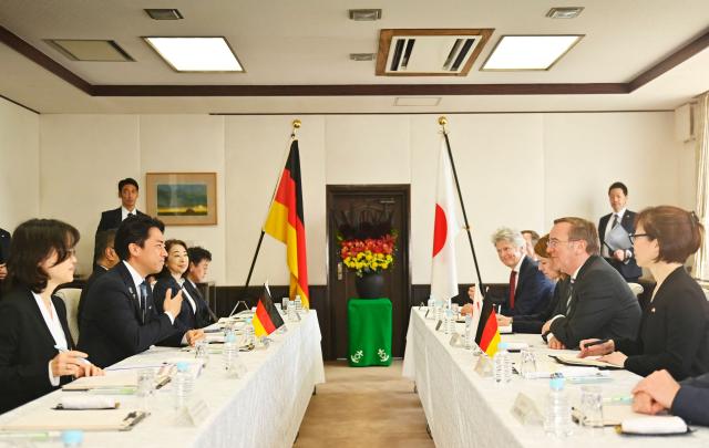 German Defence Minister Boris Pistorius (center-R) and his Japan's counterpart Shinjiro Koizumi (center-L) meet at the Japan Maritime Self-Defence Force (JMSDF)'s naval base in Yokosuka, south of Tokyo on March 22, 2026. (Photo by Ng Han Guan / POOL / AFP)