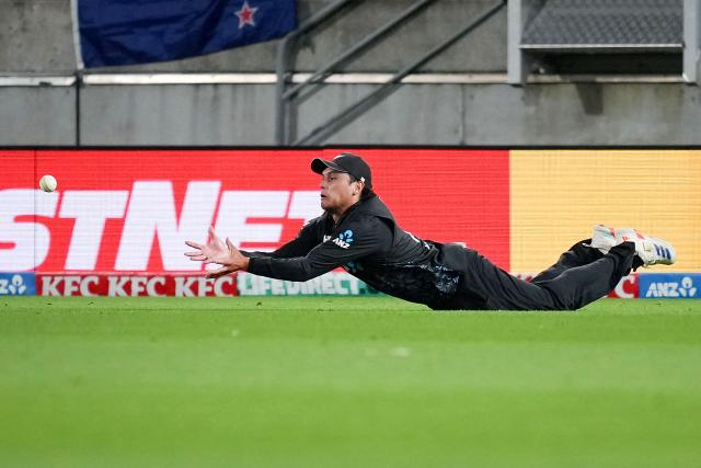 New Zealand's Katene Clarke takes a catch to dismiss South Africa's Connor Esterhuizen during the fourth Twenty20 international cricket match between New Zealand and South Africa in Wellington on March 22, 2026. (Photo by Marty MELVILLE / AFP)