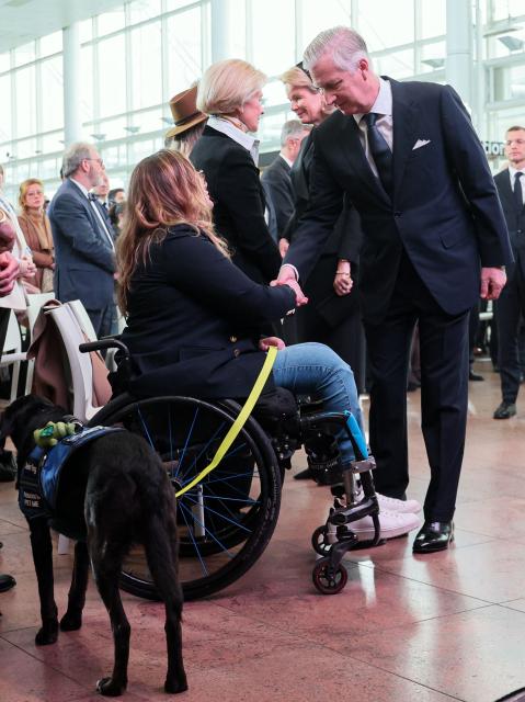 King Philippe - Filip of Belgium (R) shakes hands with a victim of the 2016 Brussels Airport attacks during the commemoration marking the 10th anniversary of the attacks at the Brussels Airport in Zaventem on March 22, 2026. On March 22, 2016, 32 people were killed and 324 got injured in suicide bombings at Zaventem national airport and Maalbeek/ Maelbeek metro station, which were claimed by ISIL. (Photo by BENOIT DOPPAGNE / Belga / AFP) / Belgium OUT