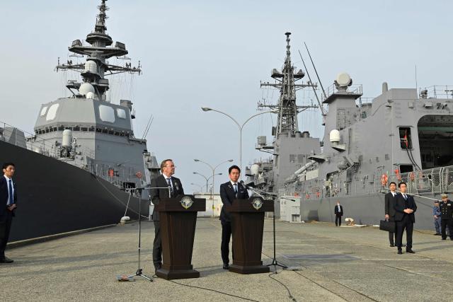 Japan's Defence Minister Shinjiro Koizumi (R) and Germany's Defence Minister Boris Pistorius (L) deliver a joint press statement at the Japan Maritime Self-Defense Force naval base in Yokosuka, south of Tokyo on March 22, 2026. (Photo by David Mareuil / POOL / AFP)