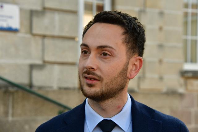 La France Insoumise (LFI) MP and Limoges' left-wing Popular Front - Union of the Social Left and The Ecologistes mayoral candidate Damien Maudet arrives to cast his vote during the second round of France's 2026 municipal elections in Limoges, central France on March 22, 2026. (Photo by Pascal LACHENAUD / AFP)