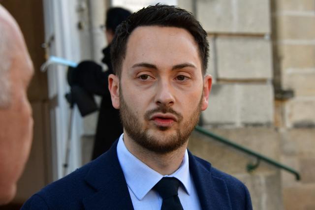 La France Insoumise (LFI) MP and Limoges' left-wing Popular Front - Union of the Social Left and The Ecologistes mayoral candidate Damien Maudet arrives to cast his vote during the second round of France's 2026 municipal elections in Limoges, central France on March 22, 2026. (Photo by Pascal LACHENAUD / AFP)