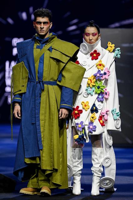 Models present creations by FDCI x Pearl Academy First Cut during the Lakmé Fashion Week in Mumbai on March 22, 2026. (Photo by Sujit JAISWAL / AFP)