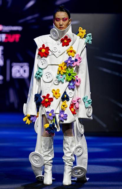 A model presents a creation by FDCI x Pearl Academy First Cut during the Lakmé Fashion Week in Mumbai on March 22, 2026. (Photo by Sujit JAISWAL / AFP)