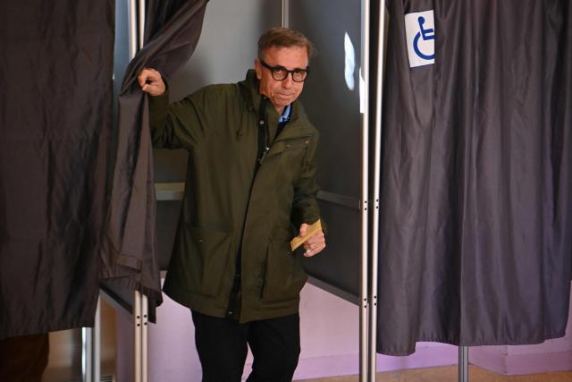 Ecologist incumbent mayor of Bordeaux and mayoral candidate Pierre Hurmic leaves the polling booth before casting his ballot during the second round of France's 2026 municipal elections in Bordeaux, southwestern France on March 22, 2026. (Photo by Christophe ARCHAMBAULT / AFP)