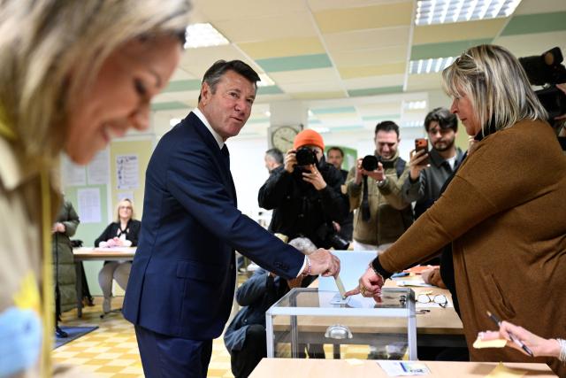 Nice's incumbent mayor and Horizons and Les Republicains (LR) candidate for re-election Christian Estrosi casts his ballot during the second round of France's 2026 municipal elections in Nice, southeastern France on March 22, 2026. (Photo by Frederic DIDES / AFP)
