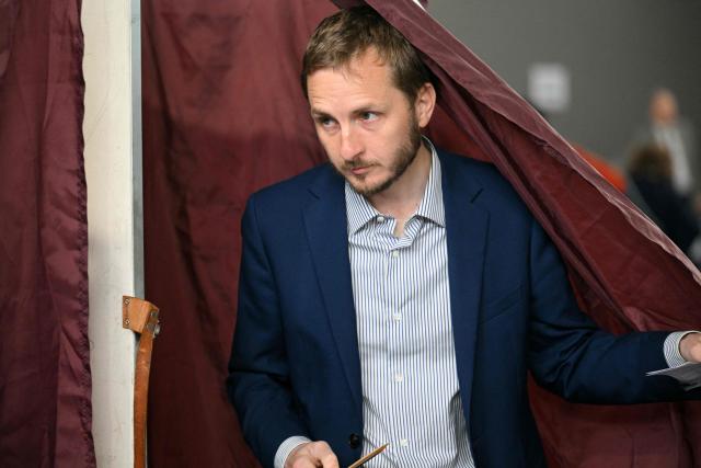France's left-wing party La France Insoumise (LFI) MP and Toulouse's mayoral candidate François Piquemal exits a polling booth before casting his vote during the party rally following the results of the second round of France's 2026 municipal elections in Toulouse, southwestern France on March 22, 2026. (Photo by Lionel BONAVENTURE / AFP)