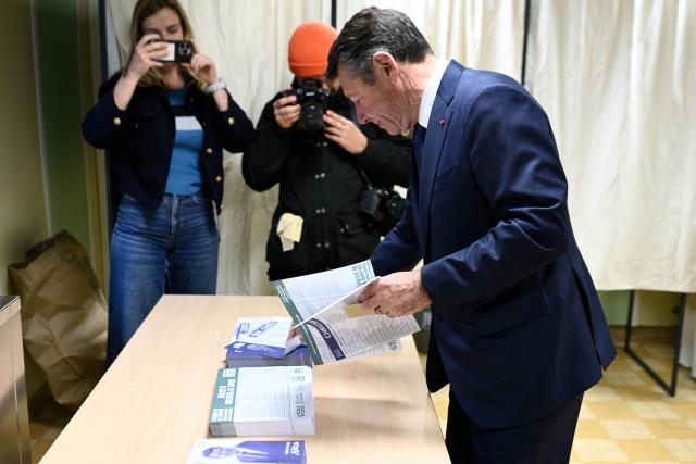 Nice's incumbent mayor and Horizons and Les Republicains (LR) candidate for re-election Christian Estrosi arrives to cast his ballot during the second round of France's 2026 municipal elections in Nice, southeastern France on March 22, 2026. (Photo by Frederic DIDES / AFP)