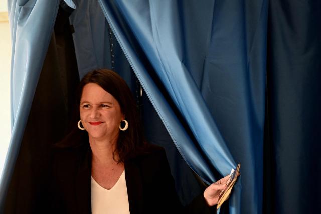 Nantes' incumbent mayor and broad left-wing coalition candidate for re-election, Socialist Party (PS) member Johanna Rolland leaves the polling booth before casting her ballot during the second round of France's 2026 municipal elections in Nantes, western France on March 22, 2026. (Photo by Sebastien Salom-Gomis / AFP)