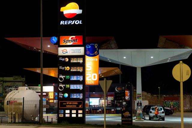 A photo taken on March 20, 2026 shows prices of combustible per litre displayed at a petrol station in Burgos, northern Spain. Spanish Prime Minister announced on March 20 a sweeping package worth five billion euros ($5.8 billion) aimed at cushioning the economic impact of the Middle East war, including cuts to value-added tax on gas and fuel expected to reduce pump prices by as much as 30 euro cents per litre, or roughly 20 euros per tank for the average car. (Photo by CESAR MANSO / AFP)