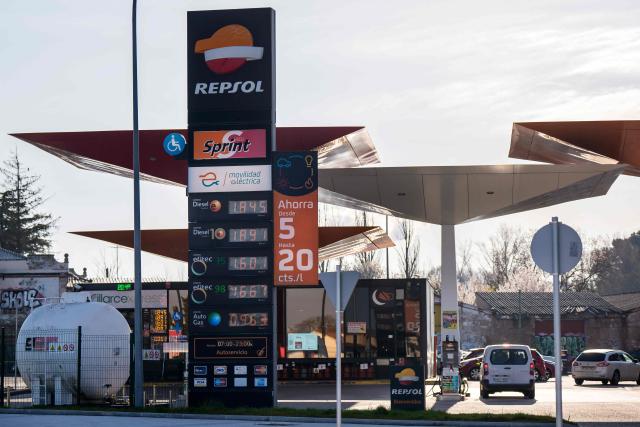A photo taken on March 22, 2026 shows prices of combustible per litre displayed at a petrol station in Burgos, northern Spain. Spanish Prime Minister announced on March 20 a sweeping package worth five billion euros ($5.8 billion) aimed at cushioning the economic impact of the Middle East war, including cuts to value-added tax on gas and fuel expected to reduce pump prices by as much as 30 euro cents per litre, or roughly 20 euros per tank for the average car. (Photo by CESAR MANSO / AFP)