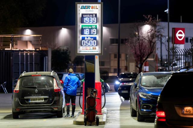 A photo taken on March 20, 2026 shows prices of combustible per litre displayed at a petrol station in Burgos, northern Spain. Spanish Prime Minister announced on March 20 a sweeping package worth five billion euros ($5.8 billion) aimed at cushioning the economic impact of the Middle East war, including cuts to value-added tax on gas and fuel expected to reduce pump prices by as much as 30 euro cents per litre, or roughly 20 euros per tank for the average car. (Photo by CESAR MANSO / AFP)