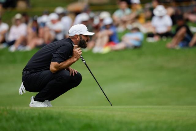 4Aces GC's US player Dustin Johnson sets up a putt on the 16th green on the fourth day of the LIV Golf South Africa tournament at The Club in Steyn City on March 22, 2026. (Photo by WIKUS DE WET / AFP)