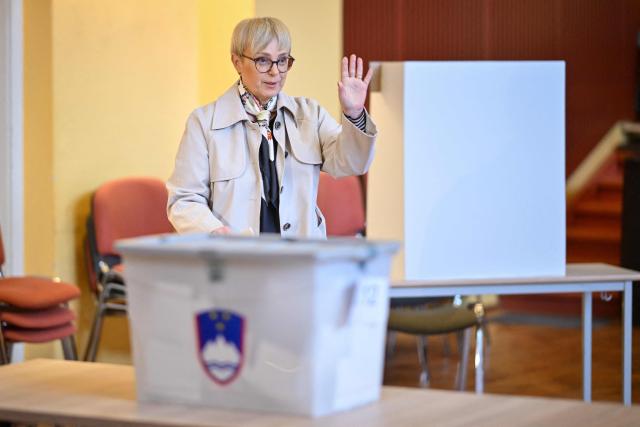 Slovenias President Natasa Pirc Musar gestures at a polling station as she arrives to cast her vote during the general election in Radomlje on March 22, 2026. Slovenians are voting in tight parliamentary elections, with the conservatives of veteran politician Janez Jansa, an admirer of US President Donald Trump, eyeing a comeback. A Jansa return could see the ex-Yugoslav nation, a European Union member of two million people, take an illiberal turn again after four years of centre-left rule under liberal Prime Minister Robert Golob. (Photo by Jure Makovec / AFP)