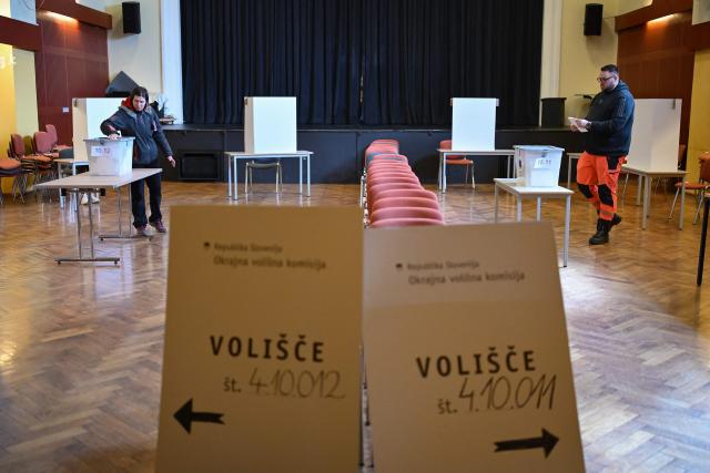 Voters prepare to cast their ballots during the general election in Radomlje on March 22, 2026. Slovenians are voting in tight parliamentary elections, with the conservatives of veteran politician Janez Jansa, an admirer of US President Donald Trump, eyeing a comeback. A Jansa return could see the ex-Yugoslav nation, a European Union member of two million people, take an illiberal turn again after four years of centre-left rule under liberal Prime Minister Robert Golob. (Photo by Jure Makovec / AFP)