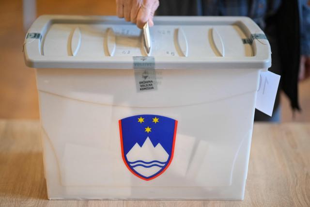 A voter casts their ballot during the general election in Radomlje on March 22, 2026. Slovenians are voting in tight parliamentary elections, with the conservatives of veteran politician Janez Jansa, an admirer of US President Donald Trump, eyeing a comeback. A Jansa return could see the ex-Yugoslav nation, a European Union member of two million people, take an illiberal turn again after four years of centre-left rule under liberal Prime Minister Robert Golob. (Photo by Jure Makovec / AFP)