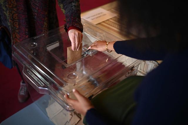 A citizen votes during the second round of France's 2026 municipal elections in Bordeaux, southwestern France on March 22, 2026. (Photo by Christophe ARCHAMBAULT / AFP)