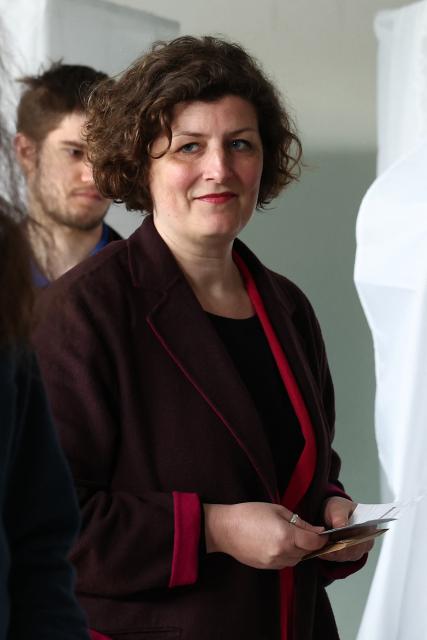 Strasbourg's incumbent mayor and Les Ecologistes candidate for re-election Jeanne Barseghian (C) prepares to cast her ballot during the second round of France's 2026 municipal elections in Strasbourg, eastern France on March 22, 2026. (Photo by FREDERICK FLORIN / AFP)