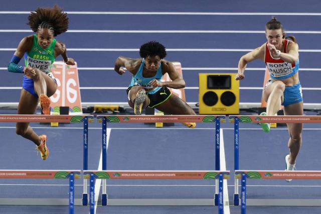 Brazil's Vitoria Alves, Bahamas' Devynne Charlton and Luxembourg's Victoria Rausch compete in the women's 60 metres hurdles heat 4 during the World Athletics Indoor Championships Kujawy Pomorze 2026 in Torun, Poland on March 22, 2026. (Photo by Wojtek RADWANSKI / AFP)