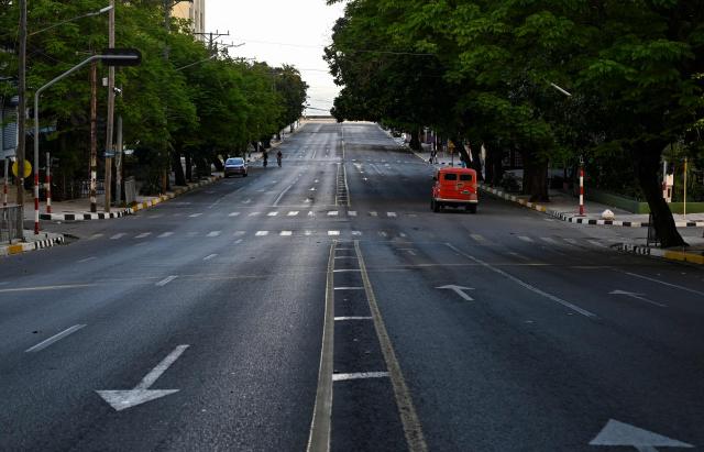 General view of an almost empty street during a nation wide blackout in Havana on March 22, 2026. A power outage struck the entire island of Cuba on March 21 the energy ministry said, in the second nationwide blackout in less than a week as its grid struggles under a US oil blockade. (Photo by YAMIL LAGE / AFP)