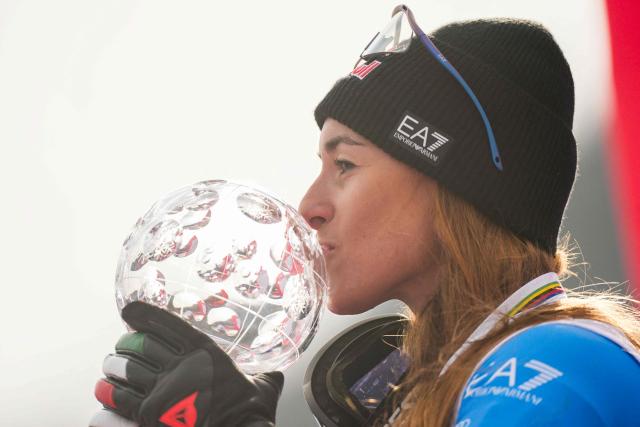 Overall winner Italy's Sofia Goggia kisses the Super-G overall trophy after the women's FIS Ski World Cup super-G event in Kvitfjell, near Lillehammer, Norway on March 22, 2026. (Photo by Cornelius Poppe / NTB / AFP) / Norway OUT