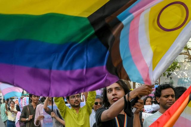 Activists and members of the LGBTQ community take part in a protest against the proposed 'Transgender Persons Amendment Bill' in Ahmedabad on March 22, 2026. (Photo by Shammi MEHRA / AFP)