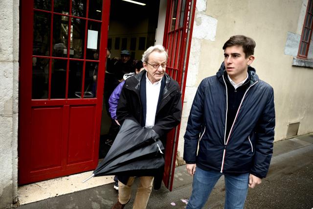 Former Mayor of Grenoble and right-wing Les Republicains (LR) party candidate for his re-election Alain Carignon leaves a polling station after voting during the second round of France's 2026 municipal elections in Grenoble, central France on March 22, 2026. (Photo by Maxime Gruss / AFP)