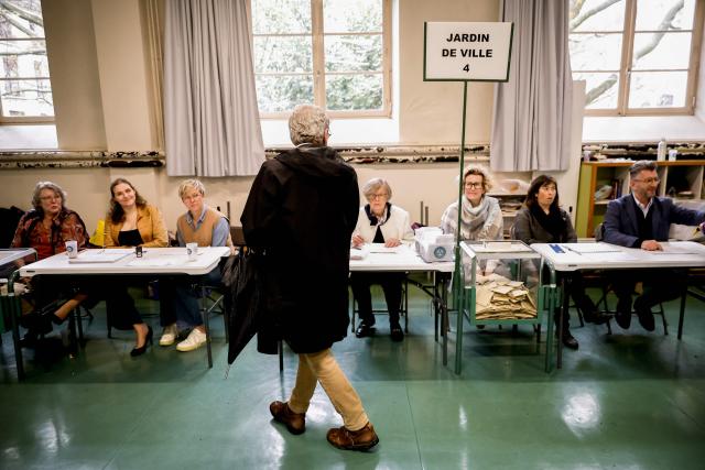 Former Mayor of Grenoble and right-wing Les Republicains (LR) party candidate for his re-election Alain Carignon prepares to vote during the second round of France's 2026 municipal elections in Grenoble, central France on March 22, 2026. (Photo by Maxime Gruss / AFP)