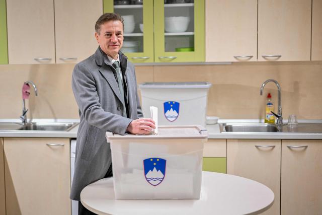 Slovenias Prime Minister Robert Golob casts his vote at a polling station during the Slovenian General Elections in Ljubljana, on March 22, 2026. Slovenians are voting in tight parliamentary elections, with the conservatives of veteran politician Janez Jansa, an admirer of US President Donald Trump, eyeing a comeback. A Jansa return could see the ex-Yugoslav nation, a European Union member of two million people, take an illiberal turn again after four years of centre-left rule under liberal Prime Minister Robert Golob. (Photo by Jure Makovec / AFP)