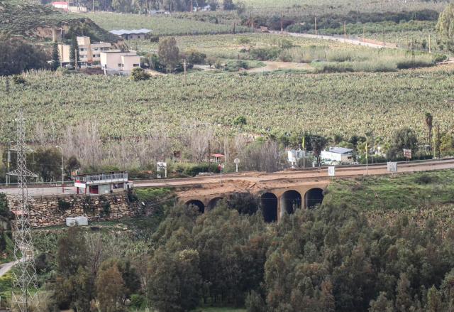 The damaged Qasmiyeh bridge located on a main highway linking villages in the Tyre district with others further north, following an Israeli airstrike in southern Lebanon on March 22, 2026. Israel's military struck a key bridge in south Lebanon on Sunday, an AFP correspondent said, after Israel's defence minister said the army had been ordered to destroy more bridges over the Litani River. Lebanon was drawn into the Middle East war on March 2, when pro-Iran Hezbollah launched rockets towards Israel in response to US-Israeli strikes that killed Iranian supreme leader on February 28, 2026. (Photo by Kawnat HAJU / AFP) / 