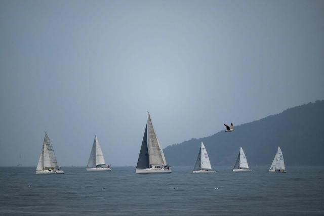 This photograph shows sailboats off the beach of Mourillon, in the Bay of Toulon, southern France on March 22, 2026. (Photo by MIGUEL MEDINA / AFP)
