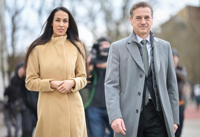 Slovenias Prime Minister Robert Golob (R) and his wife Tina (L) arrive to cast their votes at a polling station during the Slovenian General Elections in Ljubljana, on March 22, 2026. Slovenians are voting in tight parliamentary elections, with the conservatives of veteran politician Janez Jansa, an admirer of US President Donald Trump, eyeing a comeback. A Jansa return could see the ex-Yugoslav nation, a European Union member of two million people, take an illiberal turn again after four years of centre-left rule under liberal Prime Minister Robert Golob. (Photo by Jure Makovec / AFP)