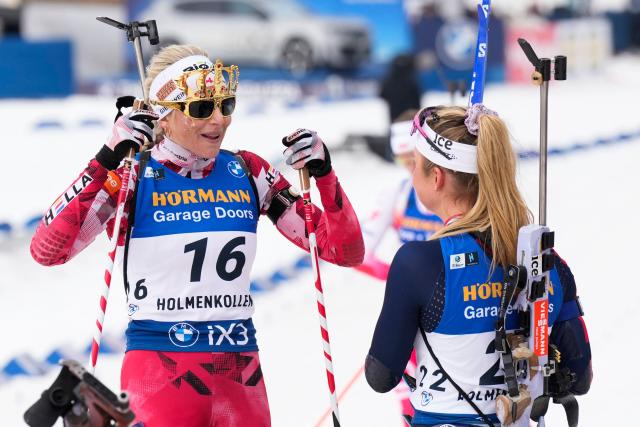 Austria's Lisa Theresa Hauser (L) ends her career and is celebrated after the women's 12,5km mass start event at the IBU Biathlon World Cup in Holmenkollen, Oslo on March 22, 2026. (Photo by Heiko Junge / NTB / AFP) / Norway OUT