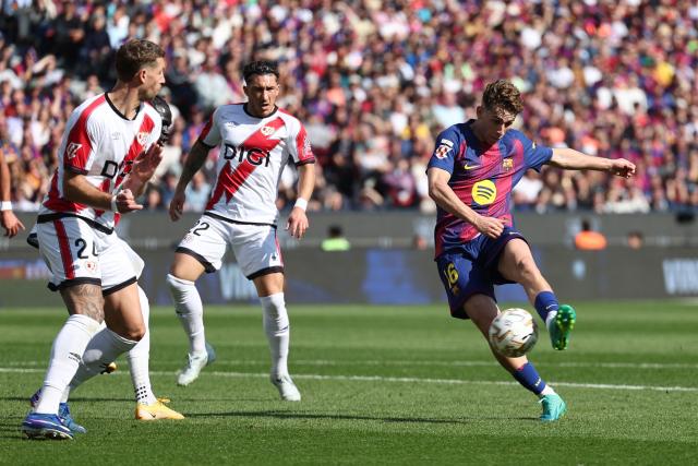 Barcelona's Spanish midfielder #16 Fermin Lopez kicks the ball during the Spanish league football match between FC Barcelona and Rayo Vallecano de Madrid at Camp Nou Stadium in Barcelona on March 22, 2026. (Photo by Josep LAGO / AFP)