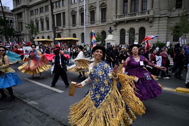 Dancers perform during a demonstration on World Water Day amid President Jose Antonio Kast's plans to roll back environmental protections in Santiago on March 22, 2026. (Photo by RODRIGO ARANGUA / AFP)