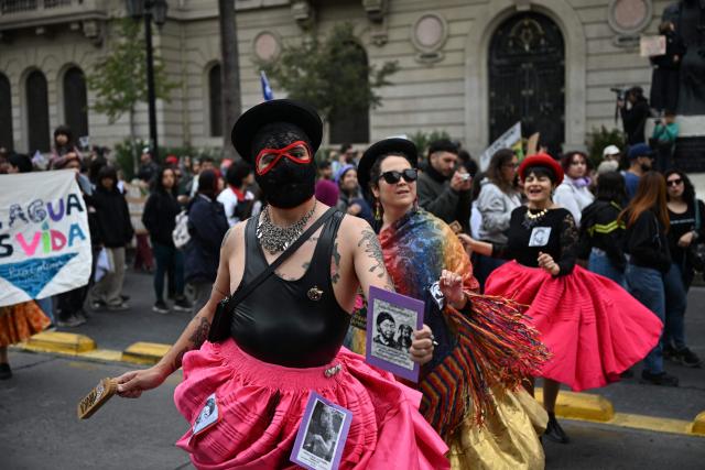Dancers perform during a demonstration on World Water Day amid President Jose Antonio Kast's plans to roll back environmental protections in Santiago on March 22, 2026. (Photo by RODRIGO ARANGUA / AFP)