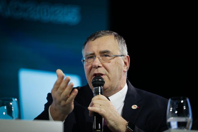 (FILES) Chairman and CEO of TotalEnergies Patrick Pouyanne speaks during the Euronext 13th annual conference in Paris on March 18, 2025. If the war in the Middle East drags out more than six months, economies around the world would suffer "real impacts", the head of French oil giant TotalEnergies said on March 18, 2025. (Photo by Thibaud MORITZ / AFP)