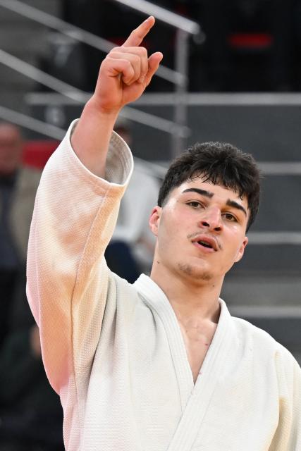 Georgia's Luka Javakhishvili reacts after winning the men's under 90 kg bronze medal bout at the Tbilisi Grand Slam judo tournament in Tbilisi on March 22, 2026. (Photo by Vano SHLAMOV / AFP)