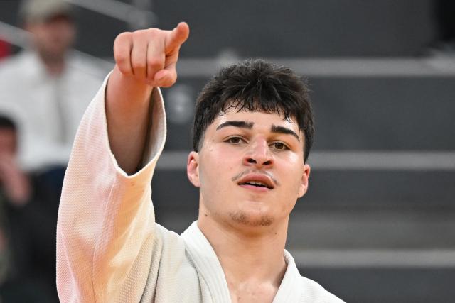 Georgia's Luka Javakhishvili reacts after winning the men's under 90 kg bronze medal bout at the Tbilisi Grand Slam judo tournament in Tbilisi on March 22, 2026. (Photo by Vano SHLAMOV / AFP)