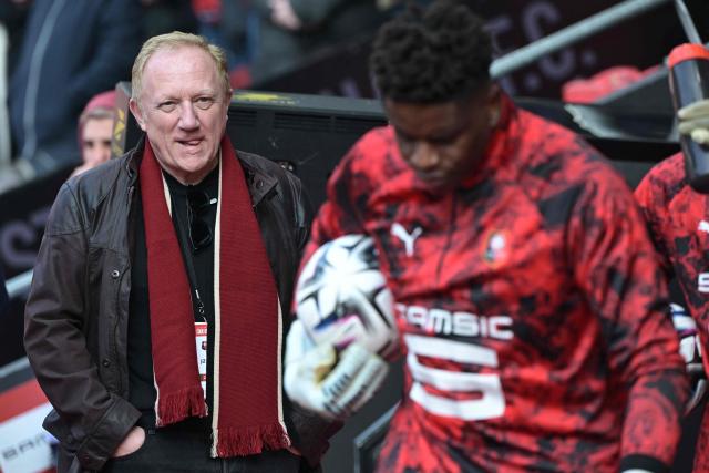 Co-owner of the Stade Rennais football club French businessman and CEO of Kering Francois-Henri Pinault (L) attends the French L1 football match between Stade Rennais FC and FC Metz at the Roazhon Park stadium in Rennes, western France on March 22, 2026. (Photo by DAMIEN MEYER / AFP)
