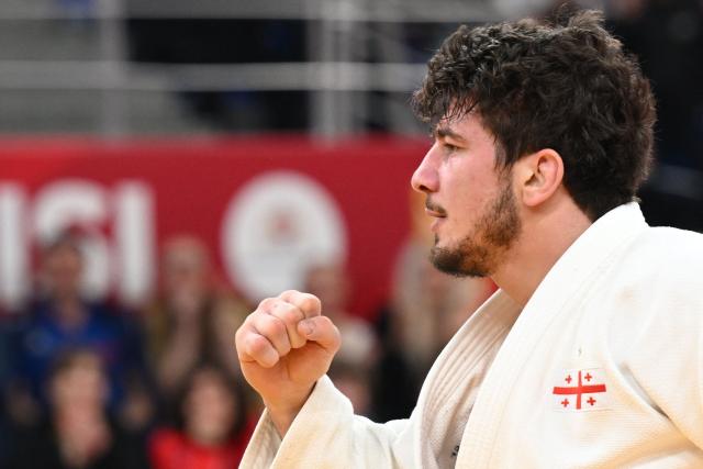 Georgia's Luka Maisuradze reacts after winning the men's under 90 kg final bout at the Tbilisi Grand Slam judo tournament in Tbilisi on March 22, 2026. (Photo by Vano SHLAMOV / AFP)