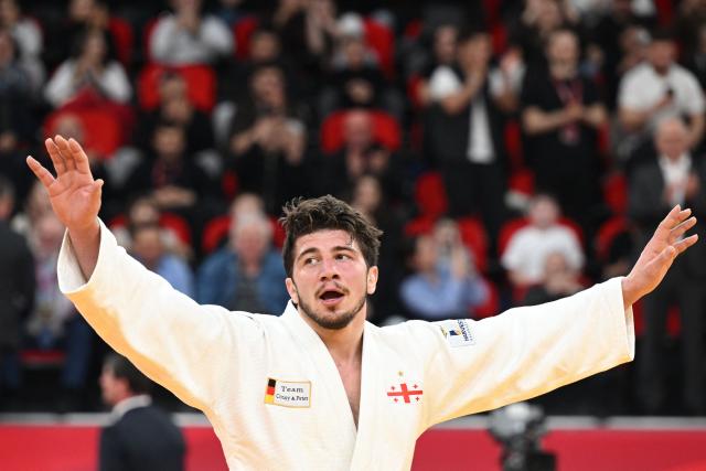 Georgia's Luka Maisuradze reacts after winning the men's under 90 kg final bout at the Tbilisi Grand Slam judo tournament in Tbilisi on March 22, 2026. (Photo by Vano SHLAMOV / AFP)