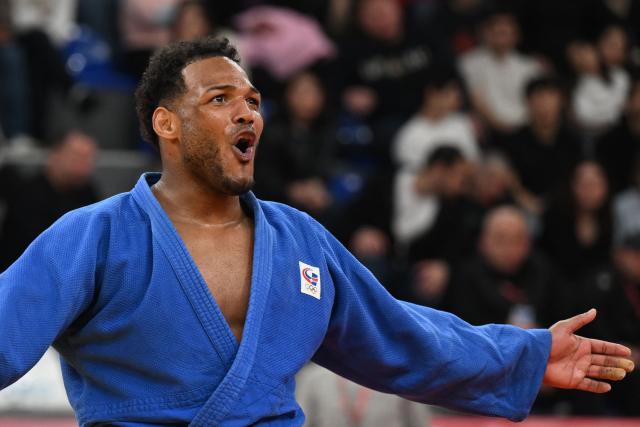 Dominican Republic's Robert Florentino reacts after winning the men's under 100 kg bronze medal bout at the Tbilisi Grand Slam judo tournament in Tbilisi on March 22, 2026. (Photo by Vano SHLAMOV / AFP)
