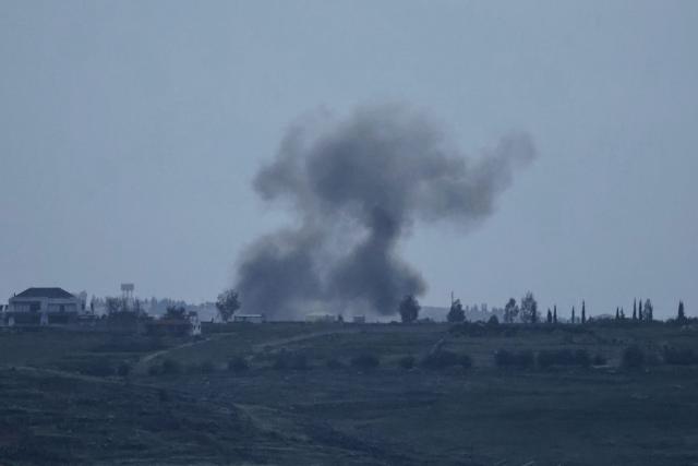 A photograph taken from the southern Lebanese district of Marjeyoun shows smoke as it rises from the site of an Israeli airstrike that targeted the village of Zawtar on March 22, 2026. Lebanon was drawn into the Middle East war on March 2, when pro-Iran Hezbollah launched rockets towards Israel in response to US-Israeli strikes that killed Iranian supreme leader on February 28, 2026. (Photo by AFP) / 