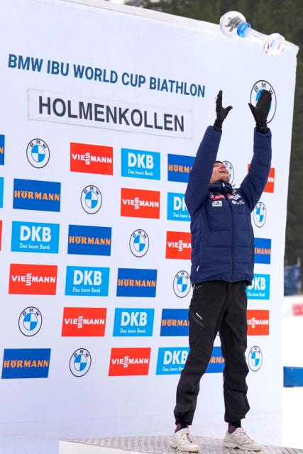 France's Eric Perrot celebrates with the crystal trophy after the IBU Biathlon World Cup in Holmenkollen, Oslo on March 22, 2026. (Photo by Heiko Junge / NTB / AFP) / Norway OUT