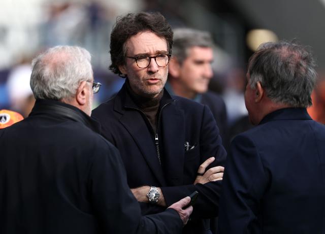 French representative of the Agache family holding company, Antoine Arnault (C) discusses during the French L1 football match between Paris FC and Le Havre AC at the Stade Jean-Bouin in Paris on March 22, 2026. (Photo by FRANCK FIFE / AFP)