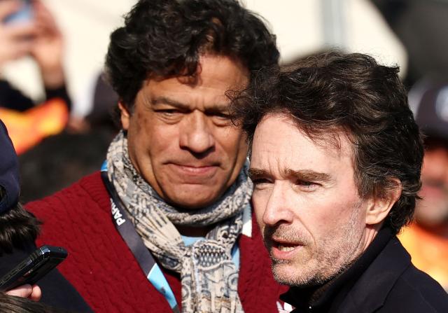 French representative of the Agache family holding company, Antoine Arnault (R) discusses with Paris Saint-Germain's former player Brazilian Rai during the French L1 football match between Paris FC and Le Havre AC at the Stade Jean-Bouin in Paris on March 22, 2026. (Photo by FRANCK FIFE / AFP)