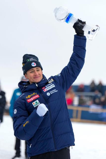 France's Eric Perrot celebrates with the crystal trophy after the IBU Biathlon World Cup in Holmenkollen, Oslo on March 22, 2026. (Photo by Heiko Junge / NTB / AFP) / Norway OUT