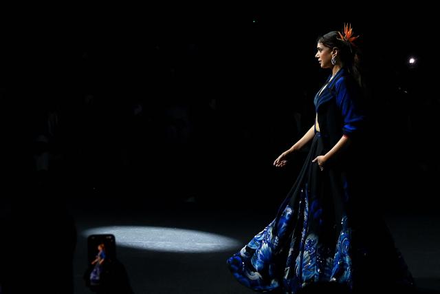 Bollywood actress Aditi Rao Hydari presents a creation designed by her and Satya Paul at Lakme Fashion Week in Mumbai on March 22, 2026. (Photo by Sujit JAISWAL / AFP)
