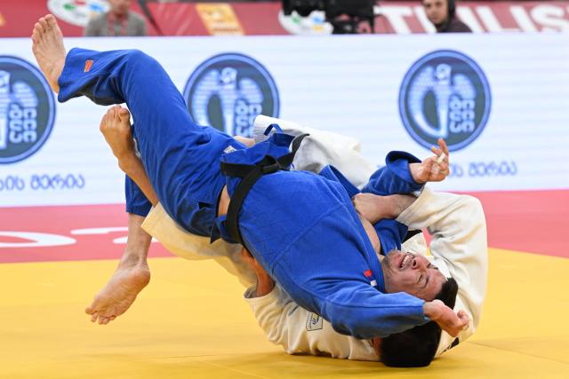 Russia's Idar Bifov (white) competes against Russia's Niiaz Bilalov in the men's under 100 kg final bout at the Tbilisi Grand Slam judo tournament in Tbilisi on March 22, 2026. (Photo by Vano SHLAMOV / AFP)